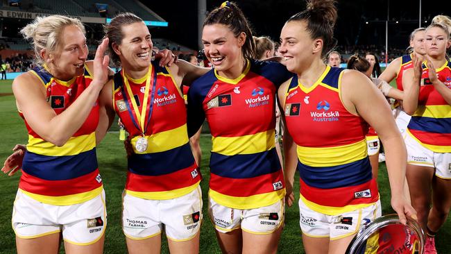 Marijana Rajcic, Chelsea Randall, Anne Hatchard and Ebony Marinoff celebrate their massive win. Picture: James Elsby/AFL Photos via Getty Images)