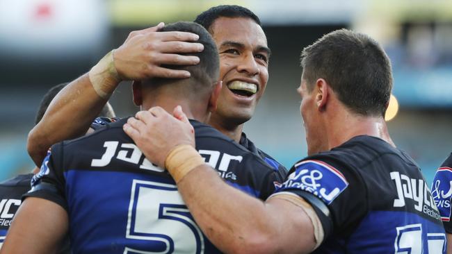 William Hopoate and the Bulldogs celebrate a try against the Dragons.