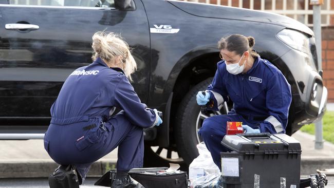 Forensics take finger prints from a Mercedes ute parked on Dalton Road. Picture: Sarah Matray