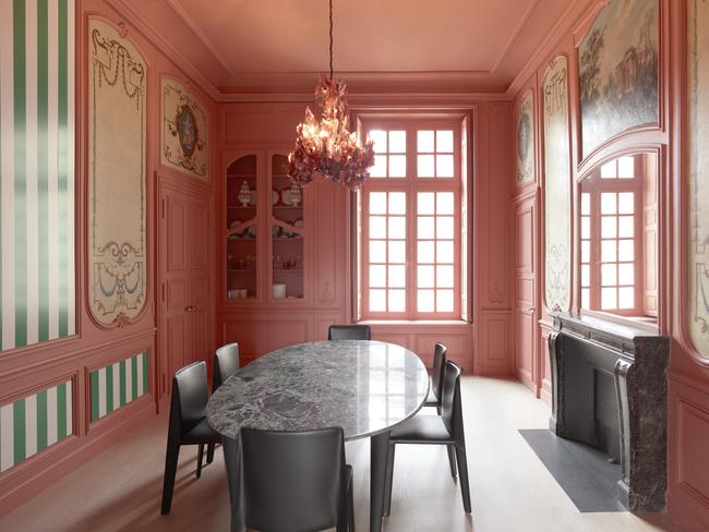 Clockwise from above, in the dining area, a contemporary wall installation by Daniel Buren sits alongside **Allegory of the Arts** - **Sculpture** and **Painting** canvases on woodwork above the north and south doors. Over the fireplace is a 400-year-old figurative work in canvas on plaster delicately restored at the Louvre. Picture: Tommaso Sartori