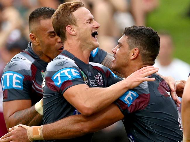 Manly's Brian Kelly celebrates scoring a try with his team matesduring the round 4 NRL game between the Manly Sea Eagles and the Canterbury Bankstown Bulldogs at Lootoland , Brookvale . Picture : Gregg Porteous