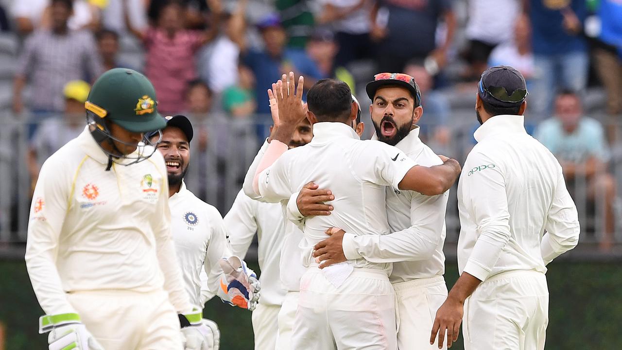 Indian captain Virat Kohli reacts after the dismissal of Australian batsman Travis Head.