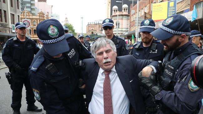 University of Western Sydney lecturer Martin Wolterding being arrested at a previous protest — the Spring Rebellion: Take Back the Streets climate and mining protest. Picture: Richard Dobson