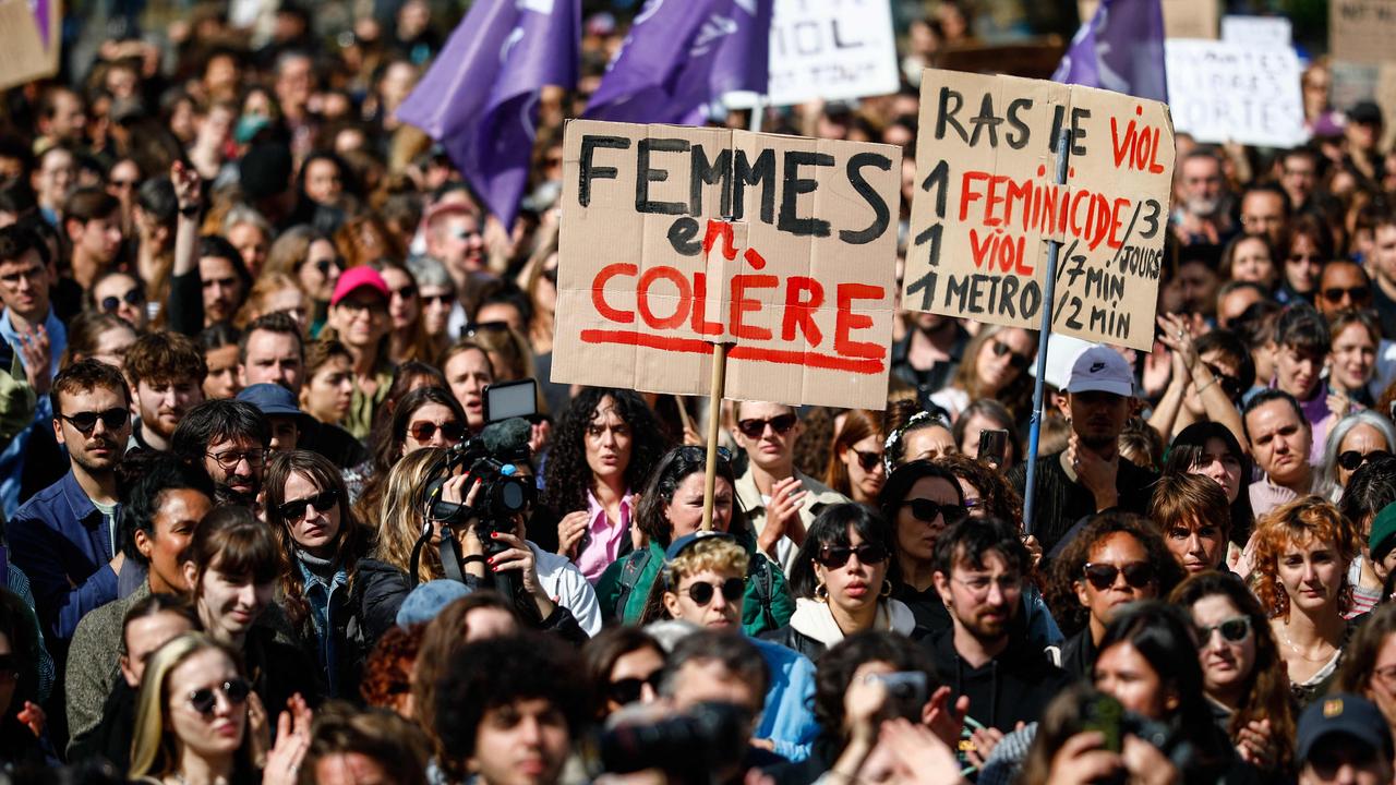 A placard which reads "Angry Women" is displayed as protesters take part in the demonstration. Picture: Ian Langsdon/ AFP