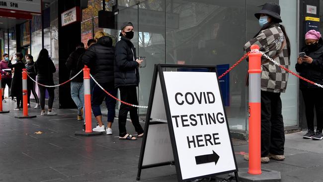 People queue at a Covid-19 testing station in Melbourne.