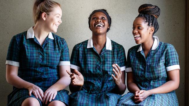 Chloe Toole, Akoi Atem and Nancy Diella from St Columba College took part in a trial program teaching young girls about endometriosis. Picture: Matt Turner