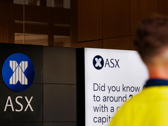 SYDNEY, AUSTRALIA - NewsWire Photos, October 29 2024. GENERIC. Stocks. Finance. Economy. A man in hi vis clothing walks past the Australian Stock Exchange, ASX, on Bridge Street. Picture: NewsWire / Max Mason-Hubers