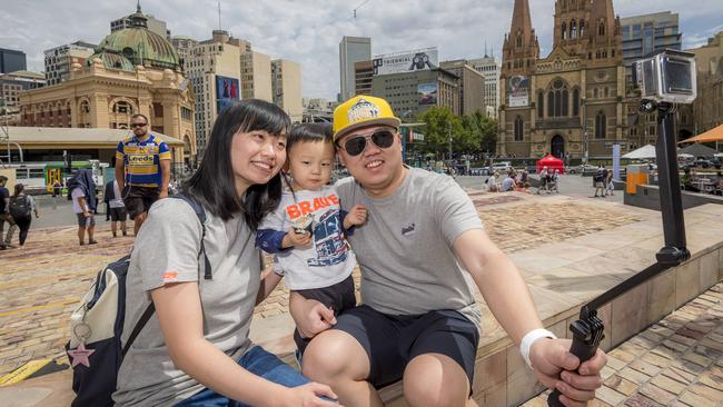 Federation Square has been voted the No 1 tourist destination in Victoria with Chinese tourists being the biggest visitors. Li, son Evan and husband Wang Wenxiao are from China. Picture: Jason Edwards