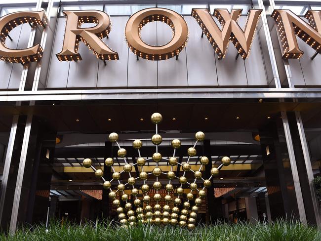 Signage adorns the side of the Crown Casino in Melbourne on March 22, 2021 after Crown Resorts received a takeover bid from US investment manager Blackstone just weeks after being denied a licence to run a multi-billion-dollar Sydney casino, the Australian gaming group said (Photo by William WEST / AFP)