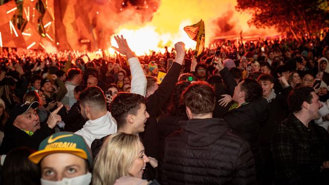 Flares were set off by fans at Federation Square. Picture: Getty