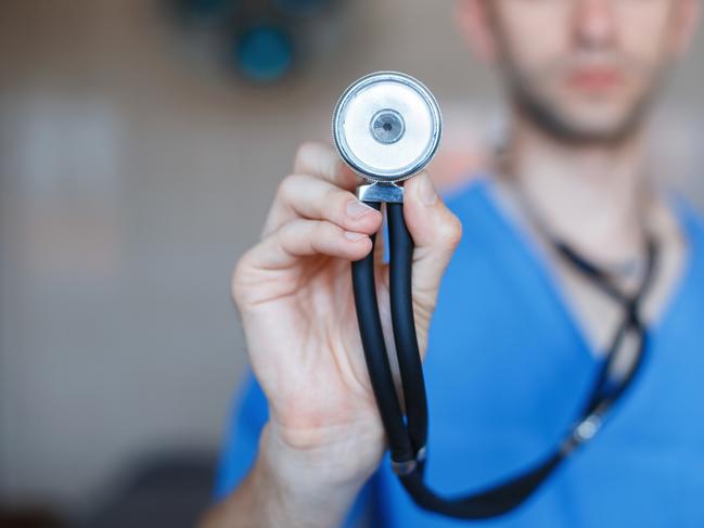 Doctor holding a Phonendoscope in his hand. Checks the health of the patient