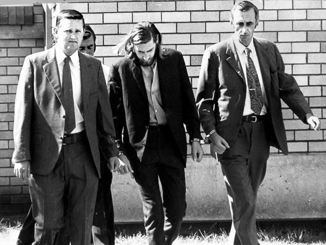 Kevin Crump is led into Narrabri Court in 1974 during his trial.