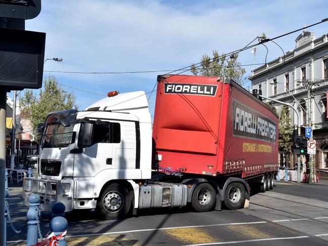 A truck got entangled in the tram lines on Racecourse Rd, Flemington. Picture: Jay Town.