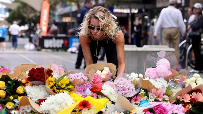 A woman leaves flowers outside the Westfield Bondi Junction shopping mall in Sydney on April 14. Picture: David Gray/AFP