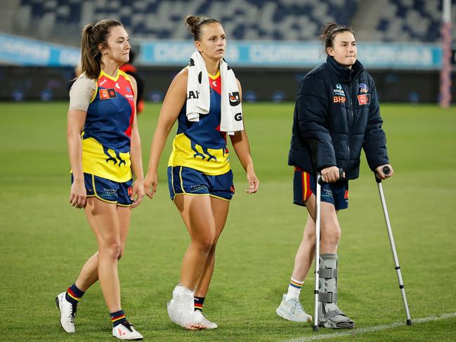 Danielle Ponter (centre) with ice on her ankle after leaving the game injured. Picture: Getty Images