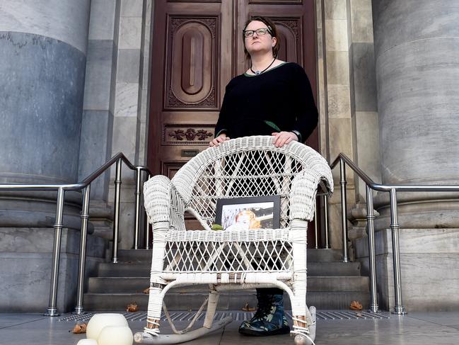 29/5/2020 - Katherine Ammear, the organiser of an online vigil for Ann Marie Smith placed a woven cane chair on the steps of Parliament House on North Terrace as a form of protest. Picture: Naomi Jellicoe