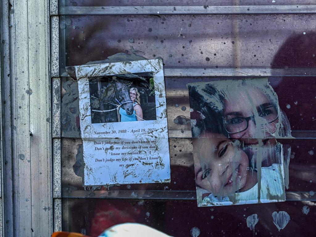 Family photos are seen taped to a window at a home in the aftermath of Hurricane Ian in San Carlos Island as shocked Florida communities counted their dead. Picture: AFP