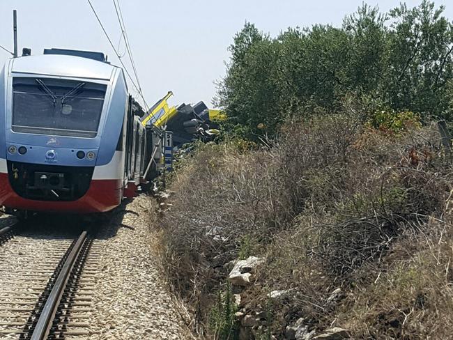 A view of the scene of a train accident after two commuter trains collided head-on near the town of Andria. Picture: Italian Firefighter Press Office via AP