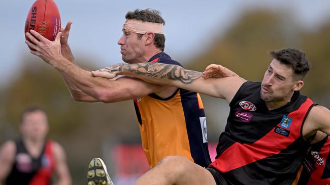 EDFL: East Keilor’s Matthew Dennis keeps his eye on the ball. Picture: Andy Brownbill