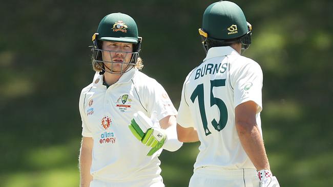 SYDNEY, AUSTRALIA - DECEMBER 07: Joe Burns and Will Pucovski of Australia A talk as they bat during day two of the three-day tour match between Australia A and India A at Drummoyne Oval on December 07, 2020 in Sydney, Australia. (Photo by Mark Metcalfe/Getty Images)