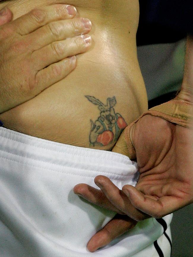 Former North and Geelong star Cameron Mooney has a Kangaroos premiership tattoo on his bum.