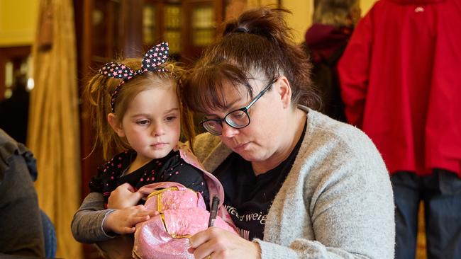 People of all ages visited Government House to sign condolence books. Picture: Matt Loxton