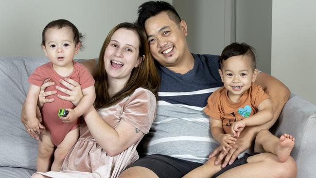 Motorbike accident survivor Henry Sun, third from left, pictured with son Oscar, 1, partner Kirsten and son Archie, 2, has recounted the terrifying moment he was struck by a car as he calls for drivers to be careful on the roads these holidays. Picture: Renae Droop