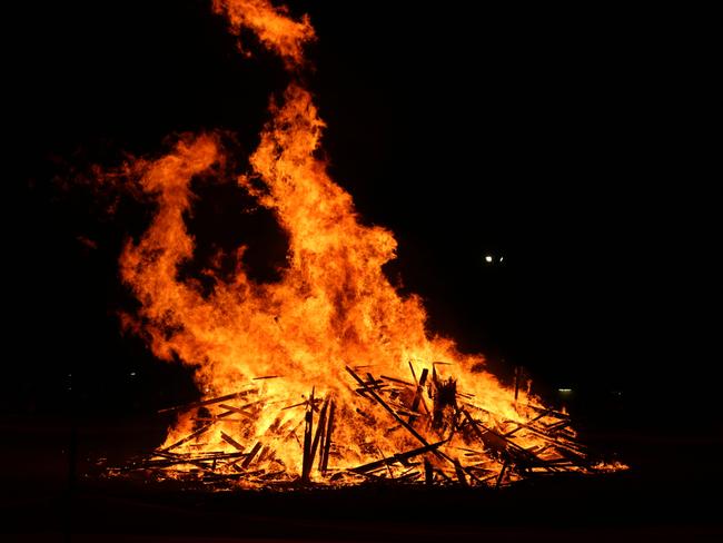 Fire takes hold of the waste wood for the Killarney Bonfire Night.