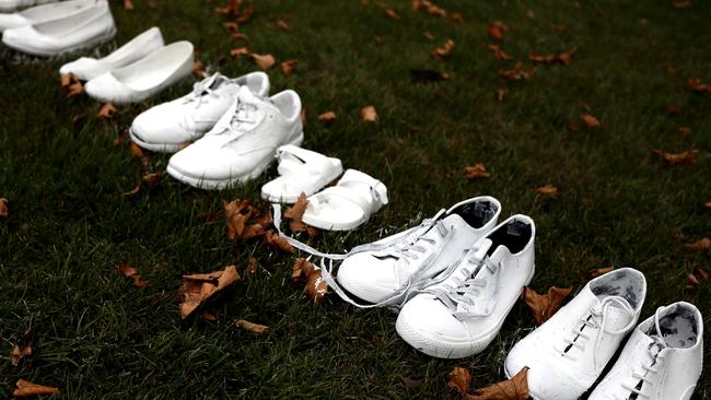 Fifty pairs of white shoes have been laid in front of All Souls Anglican Church in Christchurch in honour of victims who were killed in Friday’s terrorist attack on two mosques. Picture: Hannah Peters/Getty Images