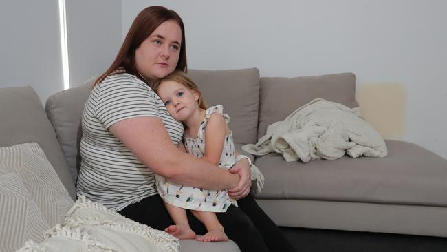 Bobby-Lee Bunney with daughter Amelia, 2, at their Ormeau home. The Gold Coast mother says it would not be worth her going back to work full time because most of her wages would be used to cover childcare costs. Picture Glenn Hampson