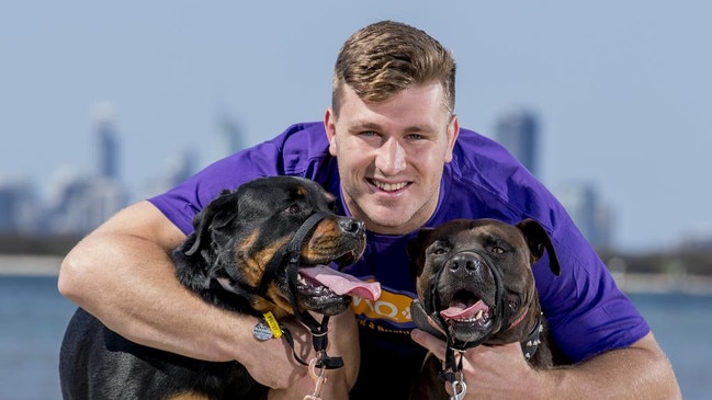 Jai Arrow with his dogs, Koda (rottweiler) and Thor (American staffordshire terrier), on a charity walk in 2019. Picture: Jerad Williams