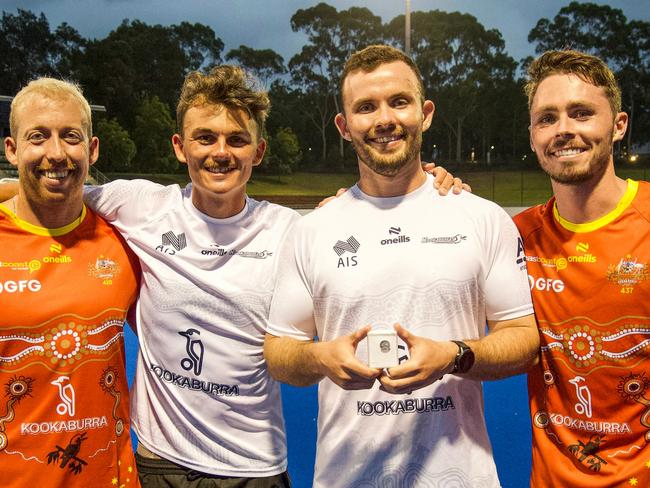 Townsville junior Mitch Nicholson (holding pin) with Queensland players Corey Weyer, Tim Howard, and Jayden Atkinson. Picture: Andrew Wiseman (Instagram: @wisemansport).