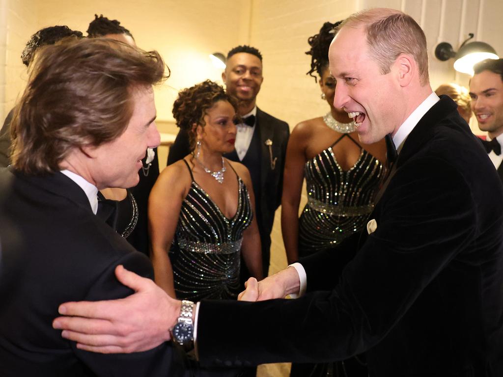 The royal shares a joke with A-lister Tom Cruise. Picture: Getty Images