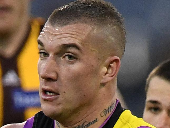 Dustin Martin of the Tigers (left) is seen in action during the Round 20 AFL match between the Richmond Tigers and the Hawthorn Hawks at the MCG in Melbourne, Sunday, August 6 , 2017. (AAP Image/Julian Smith) NO ARCHIVING, EDITORIAL USE ONLY