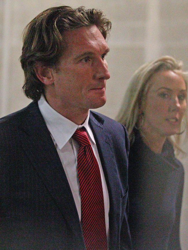 Bombers coach James Hird and his wife Tania leave AFL House.