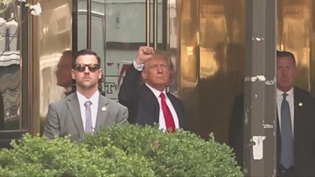 Former President Trump waves exiting Trump Tower to head to arraignment thumbnail