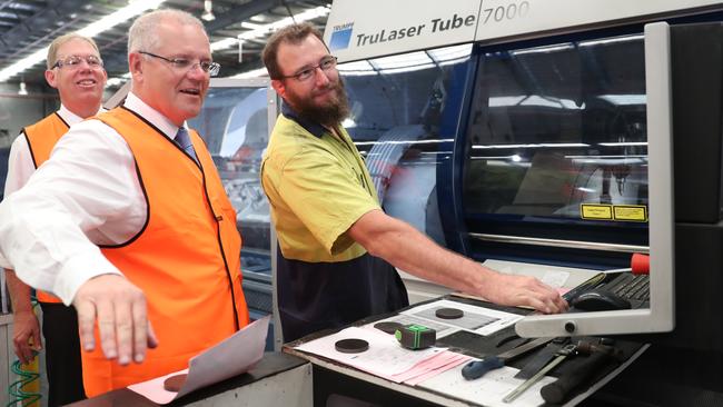 Prime Minister Scott Morrison with GCI employee Dave Lawson during a visit to GCI Group at Yatala in Queensland on Monday. Picture: Peter Wallis