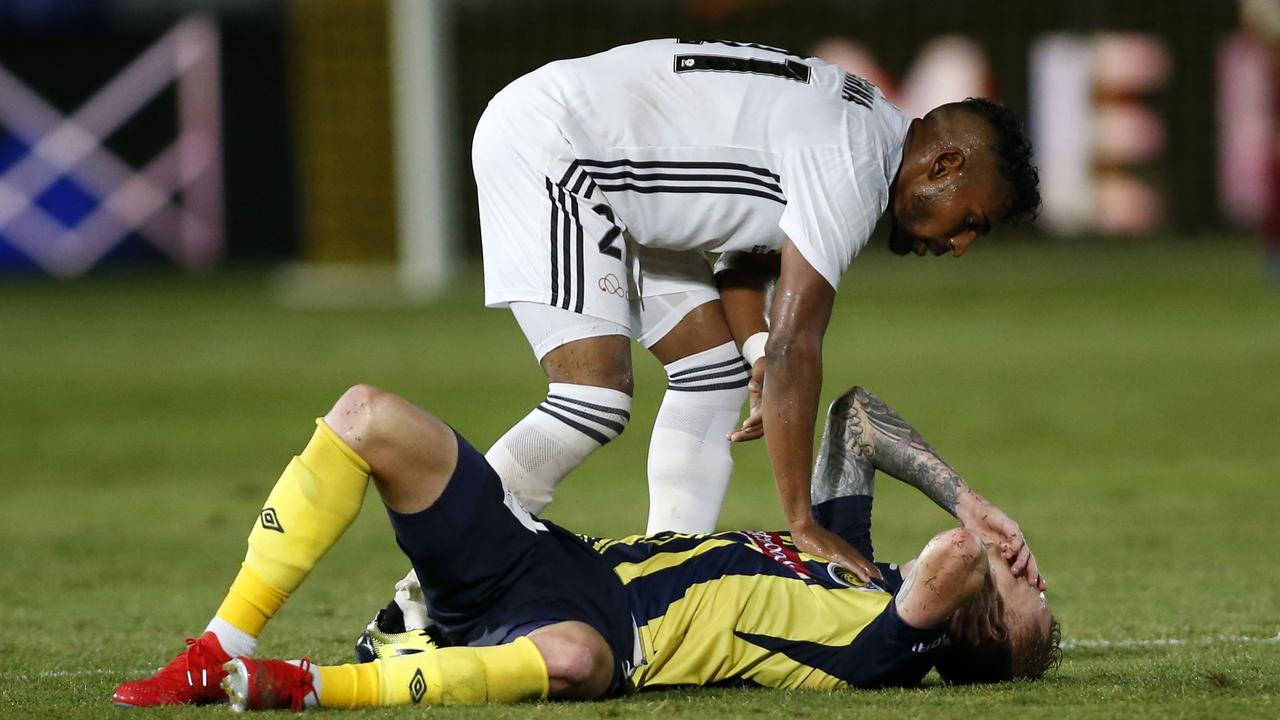 Roy Krishna checks Jack Clisby after the Central Coast Mariners were beaten 8-2 by Wellington.