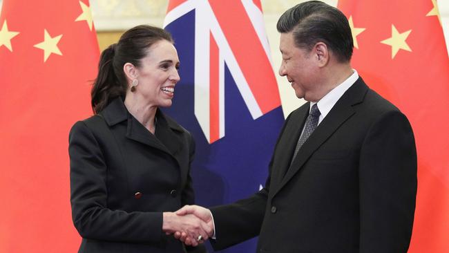 China's President Xi Jinping (R) shakes hands with Jacinda Ardern before their meeting in Beijing in 2019. Picture: AFP.