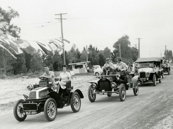 Procession of vintage cars at Bribie Bridge opening (Queensland State Archives)