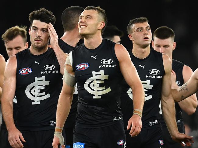 MELBOURNE, AUSTRALIA - APRIL 23: Patrick Cripps and his Blues team mates look dejected after losing the round six AFL match between Carlton Blues and St Kilda Saints at Marvel Stadium, on April 23, 2023, in Melbourne, Australia. (Photo by Quinn Rooney/Getty Images)