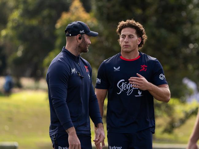 Wallabies convert Mark Nawaqanitawase talks with assistant coach Boyd Cordner. Credit: Roosters