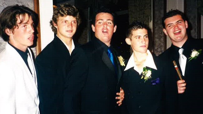 Nick Cummins, second from left, with friends on the night he graduated from St Francis College.