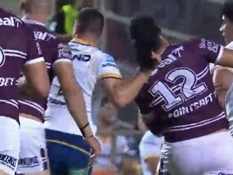 Eels halfback Mitchell Moses pulls the hair of Manly's Kelma Tuilagi at 4 Pines Park