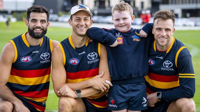 Seven-year-old Crows fan Nash Holmes with Crows players Wayne Milera,Tom Doedee and Brodie Smith after their captains run Nash will run out with the Crows this Showdown.Friday,March,31,2023.Picture Mark Brake