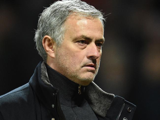 Manchester United's Portuguese manager Jose Mourinho leaves the pitch after losing a last 16 second leg UEFA Champions League football match between Manchester United and Sevilla at Old Trafford in Manchester, northwest England on March 13, 2018. / AFP PHOTO / Oli SCARFF