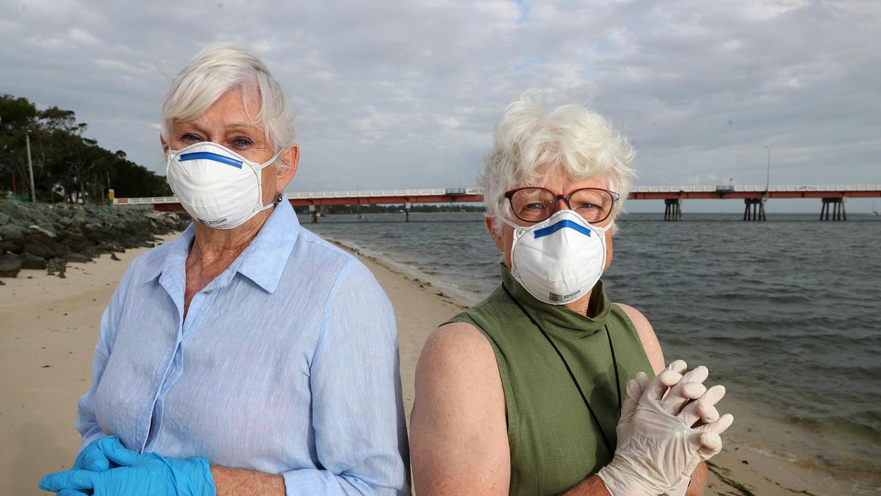 Bribie Island residents Irene Sourgnes, 75, and Diane Oxenford, 75, are calling for the island to be closed off to the mainland to protect the elderly population. Photographer: Liam Kidston.