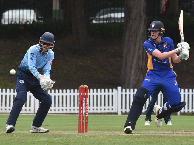 Monte Cairns plays a shot as Charlie Akle watches on. Picture: Sean Teuma