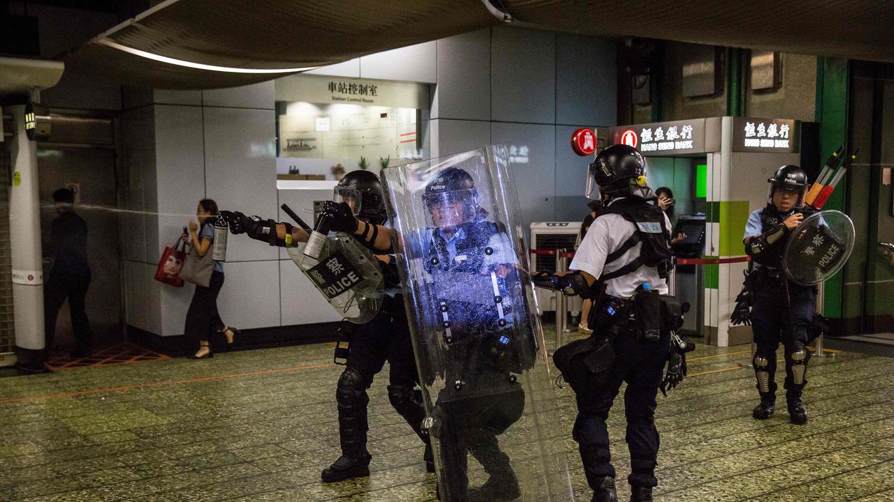 Police use pepper spray during clashes with protesters who had gathered outside Kwai Chung police station. Picture: AFP