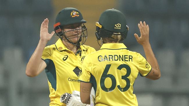 MUMBAI, INDIA - DECEMBER 28: Tahlia McGrath of Australia and Ashleigh Gardner of Australia celebrate their team's win over India during the women's One Day International Match between India and Australia at Wankhede Stadium on December 28, 2023 in Mumbai, India. (Photo by Pankaj Nangia/Getty Images)